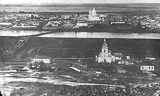 На дореволюционной фотографии на переднем плане − Николаевская церковь хутора Тубянский; за рекой − церковь Михаила Архангела станицы Казанской