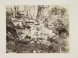 Фото 1869 года. Бахчисарайский Свято-успенский мужской монастырь, по проекту Гоняева в 1851 году возрождался как скит. Отдельные здания позднее проектировали другие архитекторы. &nbsp;Объект культурного наследия народов&nbsp;РФ федерального значения. Рег. № 911520361230006 (ЕГРОКН)