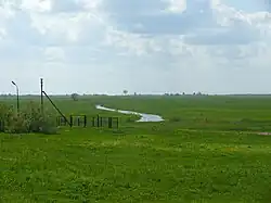 Вид на Прость с дорожной насыпи